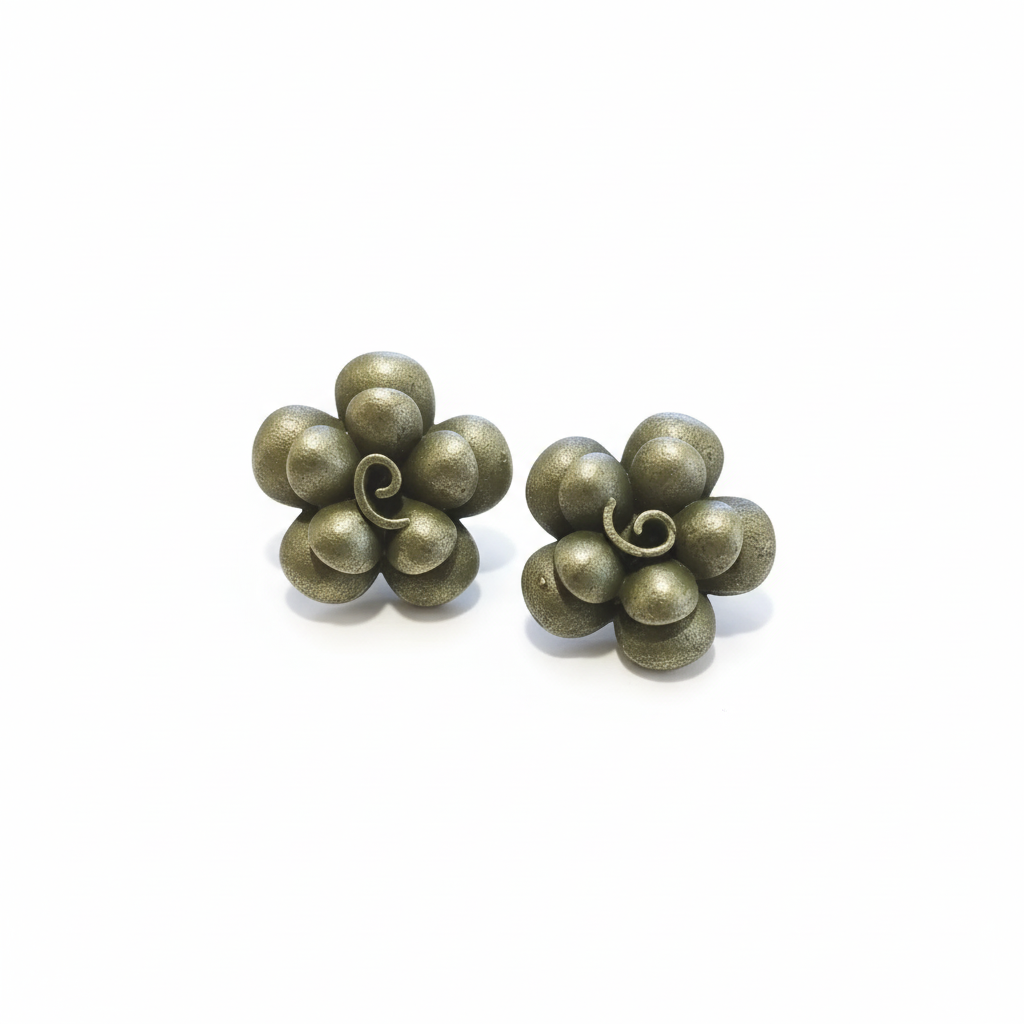 Pair of bronze flower-shaped earrings on a white background