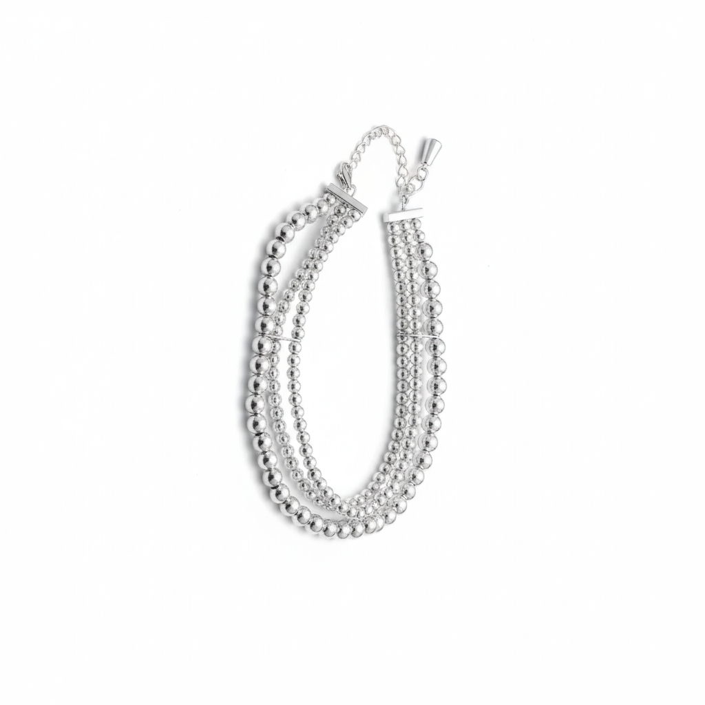 Silver beaded bracelet on a white background