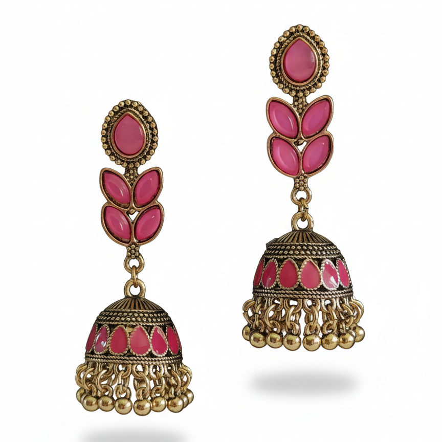 Pink and gold earrings on a white background