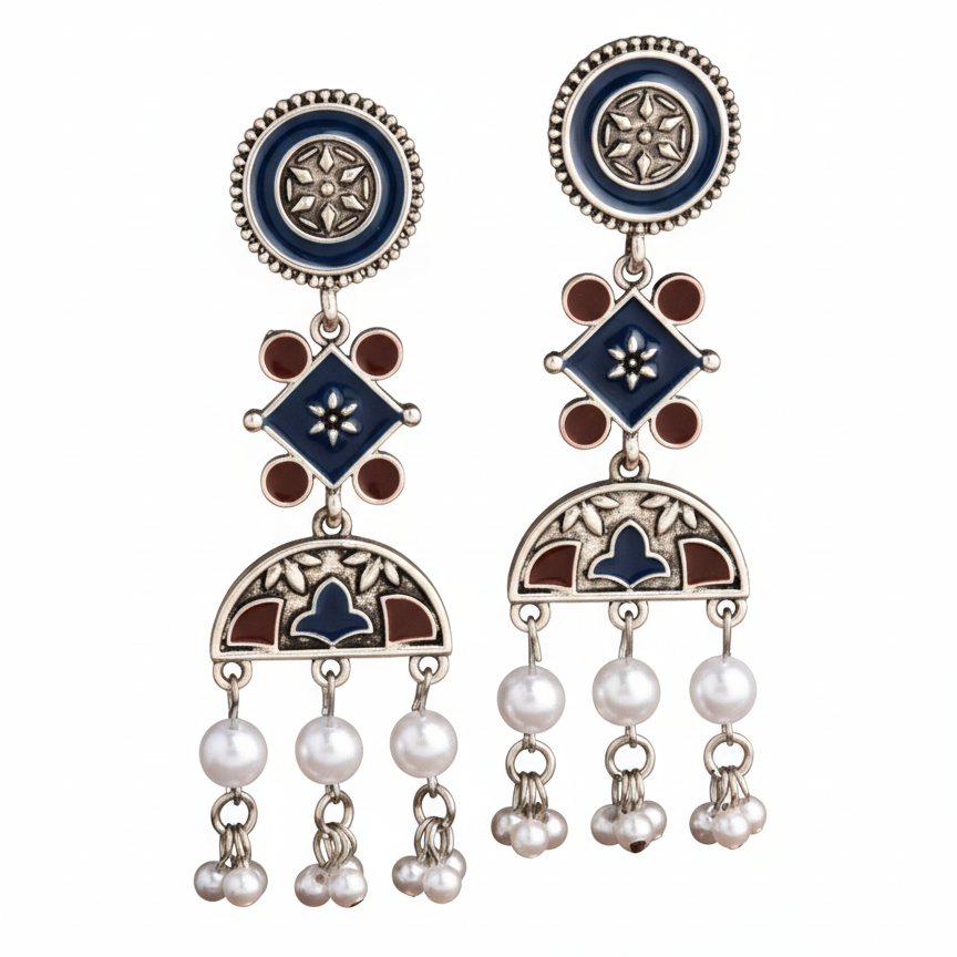 Pair of decorative earrings with blue, brown, and pearl elements on a white background