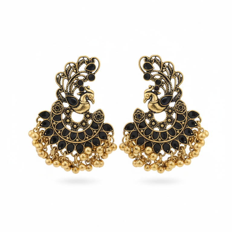 Pair of gold and black earrings on a white background