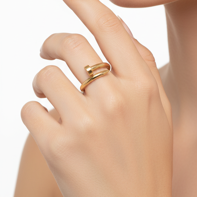 Gold ring on a finger with a neutral background