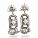 Pair of silver earrings with intricate designs on a white background