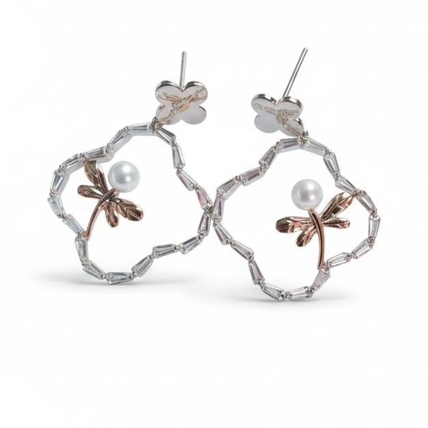 Pair of floral earrings with pearl accents on a white background