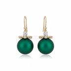 Green pearl earrings with gold and diamond accents on a white background