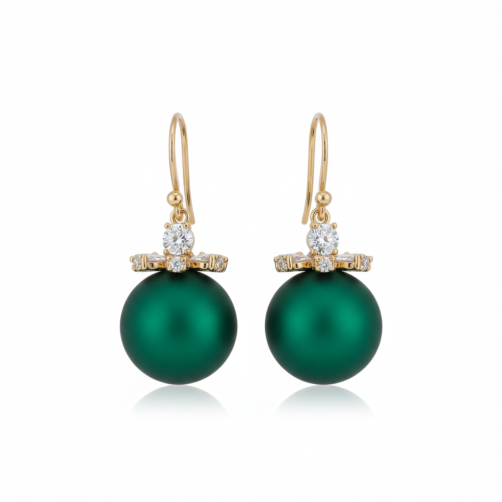 Green pearl earrings with gold and diamond accents on a white background