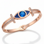 Rose gold bracelet with blue gemstone on a white background