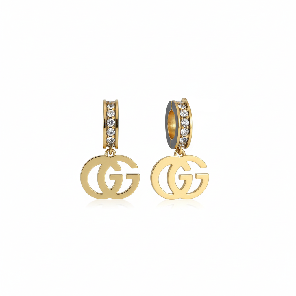Gold earrings with 'GG' logo on a white background