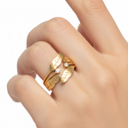 Hand wearing a gold ring on a white background