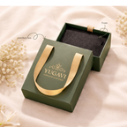 Green jewelry box with gold handle and 'Yugavi' branding on a soft beige background.