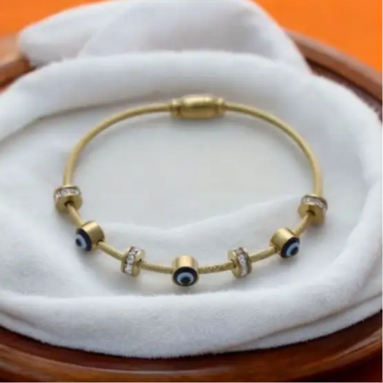 Minimalist Gold Bangle with Evil Eye Charms – Fashionable & Lucky Charm Bracelet